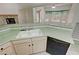 The kitchen features a breakfast bar with a dual basin sink and black appliances at 710 Tomahawk Ct, Pahrump, NV 89060
