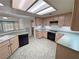 Functional kitchen with ample counter space and modern black appliances at 710 Tomahawk Ct, Pahrump, NV 89060