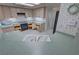 Spacious kitchen with ample storage, tile flooring, and a convenient breakfast bar at 710 Tomahawk Ct, Pahrump, NV 89060