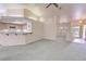 The living room shows a breakfast bar opening to the kitchen, and an entry featuring natural light at 710 Tomahawk Ct, Pahrump, NV 89060