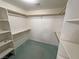 Spacious walk-in closet offers ample storage with built-in shelving and rack storage at 710 Tomahawk Ct, Pahrump, NV 89060