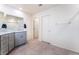 Bright bathroom with walk-in shower, granite counters, and tiled floors at 7211 Alabaster Peak St, Las Vegas, NV 89166