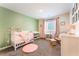 Cozy Bedroom with white crib, rocking chair, and plenty of natural light at 7211 Alabaster Peak St, Las Vegas, NV 89166