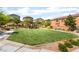 Beautiful neighborhood park with lush green grass and walking paths for outdoor enjoyment at 7211 Alabaster Peak St, Las Vegas, NV 89166