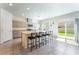 Modern kitchen with granite countertops, sleek cabinetry, stainless steel appliances, and a large island at 7211 Alabaster Peak St, Las Vegas, NV 89166