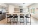 Spacious kitchen featuring a large island with seating and stainless steel appliances at 7211 Alabaster Peak St, Las Vegas, NV 89166