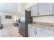 Bright kitchen with stainless steel refrigerator and sleek gray cabinets at 7211 Alabaster Peak St, Las Vegas, NV 89166