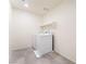 Clean laundry room featuring a modern washer and dryer set with tiled floors at 7211 Alabaster Peak St, Las Vegas, NV 89166