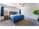 Cozy bedroom featuring plush carpet, ceiling fan, and natural light at 7211 Alabaster Peak St, Las Vegas, NV 89166