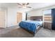 Comfortable main bedroom with carpet, ceiling fan, and bright natural light at 7211 Alabaster Peak St, Las Vegas, NV 89166