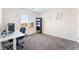 Well-lit office space with a modern desk, computer setup, and shelving, ideal for remote work at 7211 Alabaster Peak St, Las Vegas, NV 89166