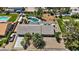 Bird's-eye view of home featuring pool, horse facilities, RV parking, desert landscaping, and a tile roof at 7675 Butterscotch Ct, Las Vegas, NV 89131