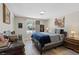 Cozy bedroom with a comfortable bed, neutral tones, and a bright window at 7675 Butterscotch Ct, Las Vegas, NV 89131