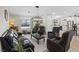 Cozy living room featuring a stylish chandelier, comfortable seating, and natural light at 7675 Butterscotch Ct, Las Vegas, NV 89131