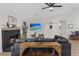 Beautiful living room features a fireplace, decor, a mounted flat-screen television, and hardwood floors at 7675 Butterscotch Ct, Las Vegas, NV 89131