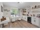 Bright office area with custom built-ins and a wine cooler at 7675 Butterscotch Ct, Las Vegas, NV 89131