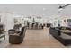Bright, open floorplan showcasing the kitchen, living, and dining areas with modern finishes at 7675 Butterscotch Ct, Las Vegas, NV 89131