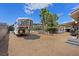 Spacious yard with a horse trailer, pool, and covered patio area at 7675 Butterscotch Ct, Las Vegas, NV 89131