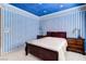Comfortable bedroom featuring patterned wallpaper and a well-lit atmosphere with plush carpet at 7889 Rancho Mirage Dr, Las Vegas, NV 89113