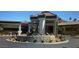 Elegant clubhouse entrance with a decorative fountain and lush landscaping at 7889 Rancho Mirage Dr, Las Vegas, NV 89113