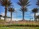 Spanish Trail community entrance featuring well-manicured landscaping and elegant signage at 7889 Rancho Mirage Dr, Las Vegas, NV 89113