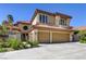 Two-story home showcasing a terracotta tile roof and an attached two-car garage at 7889 Rancho Mirage Dr, Las Vegas, NV 89113