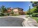 Spacious two-story house with a terracotta tile roof, a two-car garage, and mature landscaping at 7889 Rancho Mirage Dr, Las Vegas, NV 89113