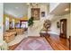 Elegant foyer featuring a grand staircase, hardwood floors, and decorative rugs at 7889 Rancho Mirage Dr, Las Vegas, NV 89113