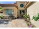 Charming home exterior featuring a stone pathway, decorative bench, and a welcoming double-door entrance at 7889 Rancho Mirage Dr, Las Vegas, NV 89113