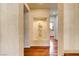 Elegant hallway with hardwood floors, decorative wall niche, and recessed lighting at 7889 Rancho Mirage Dr, Las Vegas, NV 89113