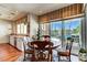 Kitchen and dinette area with large windows and sliding doors that lead to a beautiful backyard pool at 7889 Rancho Mirage Dr, Las Vegas, NV 89113