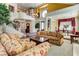 Bright, open-concept living room with staircase, and elegant furnishings at 7889 Rancho Mirage Dr, Las Vegas, NV 89113
