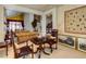 Cozy living room with classic furnishings, tapestry wall hangings, and stylish decor at 7889 Rancho Mirage Dr, Las Vegas, NV 89113