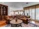 Warm living room with wood floors, an oriental rug, and a comfortable sectional sofa at 7889 Rancho Mirage Dr, Las Vegas, NV 89113