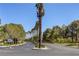 A quiet neighborhood street lined with mature trees and manicured landscaping at 7889 Rancho Mirage Dr, Las Vegas, NV 89113