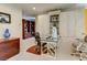 Office space featuring custom cabinets, glass desk, and hardwood accents at 7889 Rancho Mirage Dr, Las Vegas, NV 89113