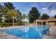 A sparkling swimming pool with a cabana for relaxing and enjoying the sun at 7889 Rancho Mirage Dr, Las Vegas, NV 89113