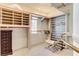 Well-organized walk in closet with custom shelving and an ornate chair at 7889 Rancho Mirage Dr, Las Vegas, NV 89113