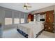 Spacious main bedroom with a king bed, mirrored wardrobes, and three large windows with blinds at 8286 Skye Gorge St, Las Vegas, NV 89166