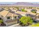 Stunning aerial view of a neighborhood with mountain views at 9052 Pine Mission Ave, Las Vegas, NV 89143