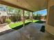 Covered patio area with green artificial grass in the backyard at 9052 Pine Mission Ave, Las Vegas, NV 89143