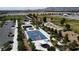 Aerial view of a community park with basketball court, playground, covered picnic area and sports field near residential area at 9052 Pine Mission Ave, Las Vegas, NV 89143