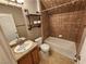 Bathroom with shower-tub combination, tiled shower walls, and decorative shelf at 9052 Pine Mission Ave, Las Vegas, NV 89143