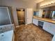 A bright bathroom featuring double sinks, and lots of storage at 9052 Pine Mission Ave, Las Vegas, NV 89143