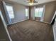 Spacious bedroom with carpet, windows, and curtains at 9052 Pine Mission Ave, Las Vegas, NV 89143