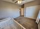 Comfortable bedroom with closet, carpet, ceiling fan, natural light and neutral paint at 9052 Pine Mission Ave, Las Vegas, NV 89143