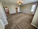 A spacious bedroom with a ceiling fan, large window, and walk-in closet at 9052 Pine Mission Ave, Las Vegas, NV 89143