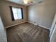 Bedroom with a ceiling fan, carpeted floor, large window, and neutral paint at 9052 Pine Mission Ave, Las Vegas, NV 89143