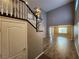 Inviting entryway featuring a staircase, wood-look flooring, and an open view to the living area at 9052 Pine Mission Ave, Las Vegas, NV 89143