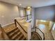 Second story hallway looking down into the entry and open-concept living space with staircase at 9052 Pine Mission Ave, Las Vegas, NV 89143